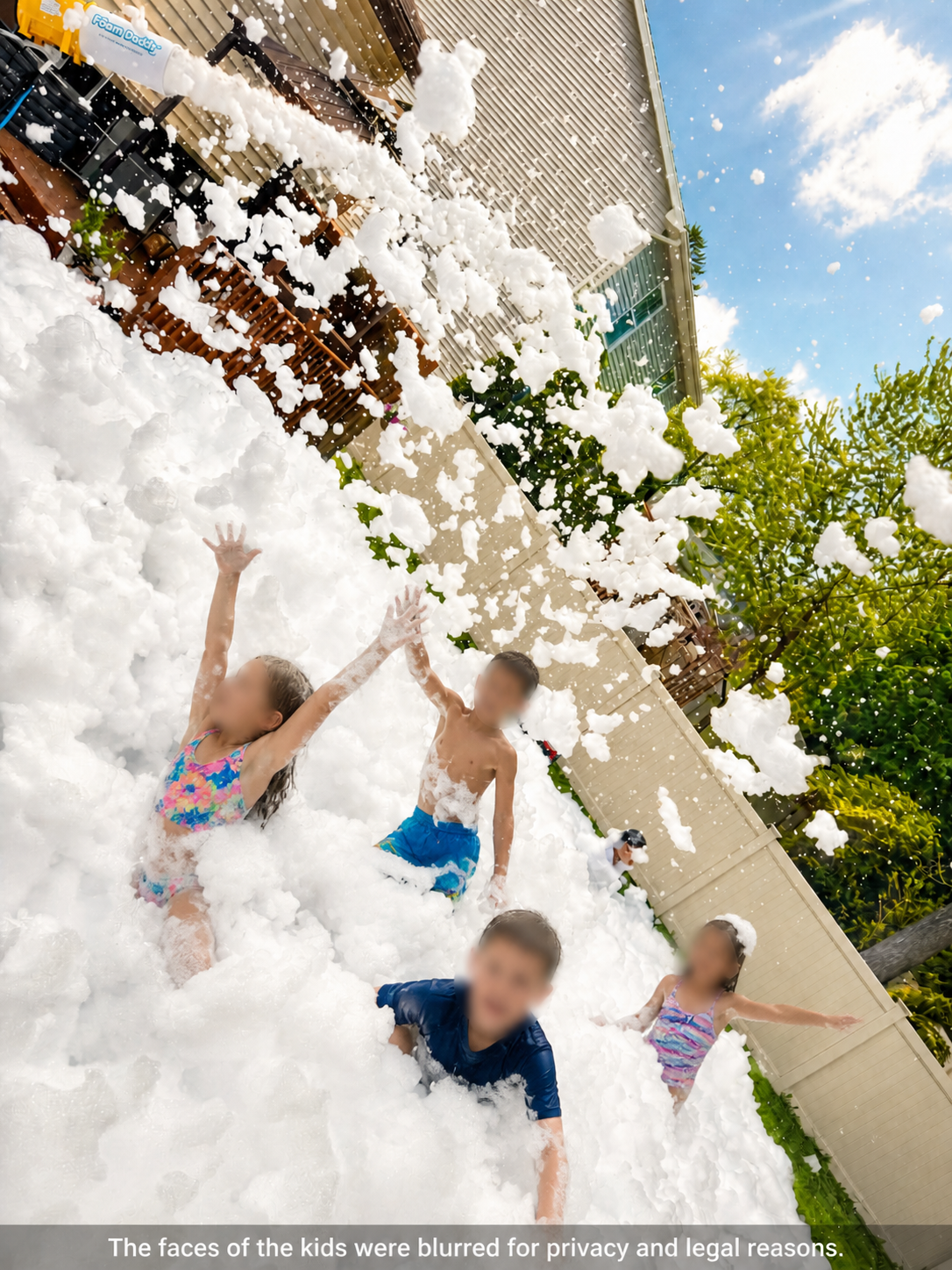 Kids playing in a backyard foam party