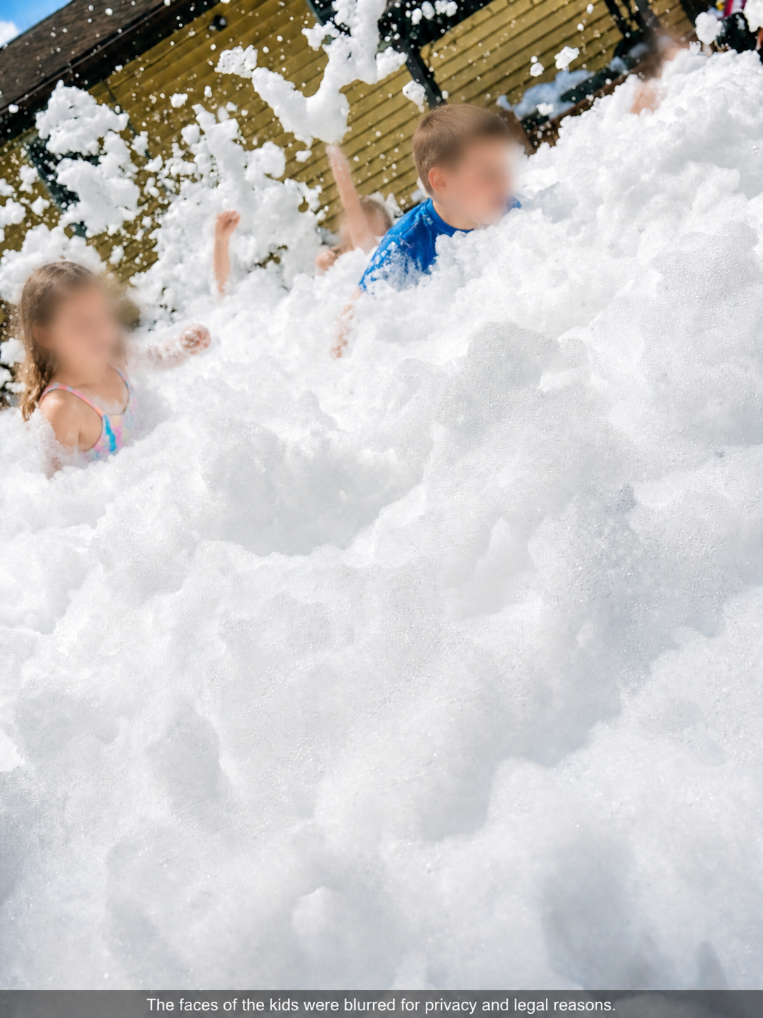 Kids surrounded by thick foam bubbles