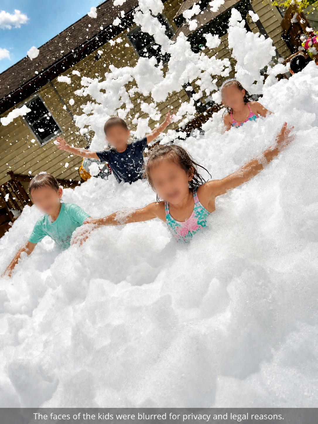 Children reaching through deep foam bubbles
