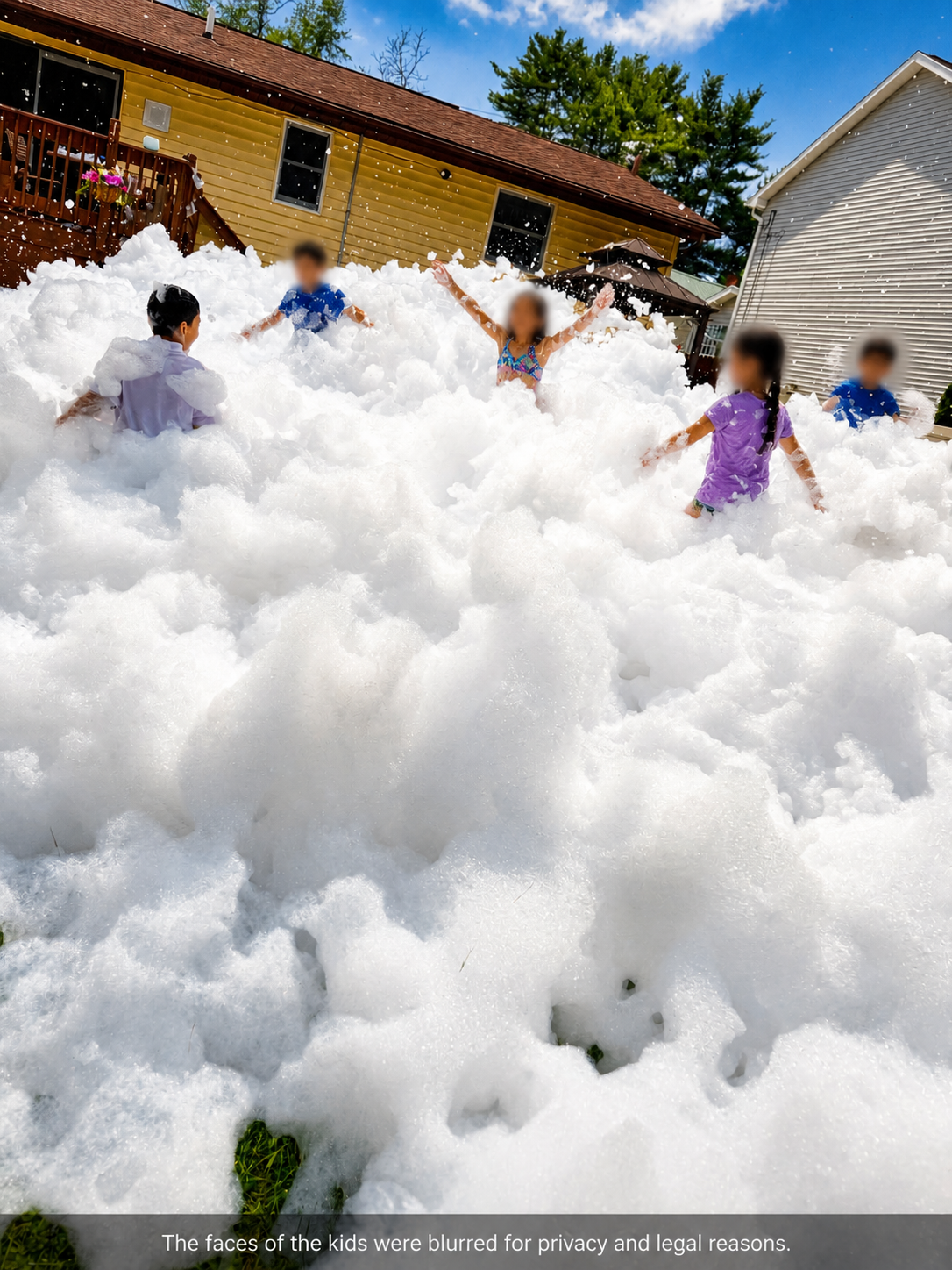 Kids and foam cannon at a sunny backyard party